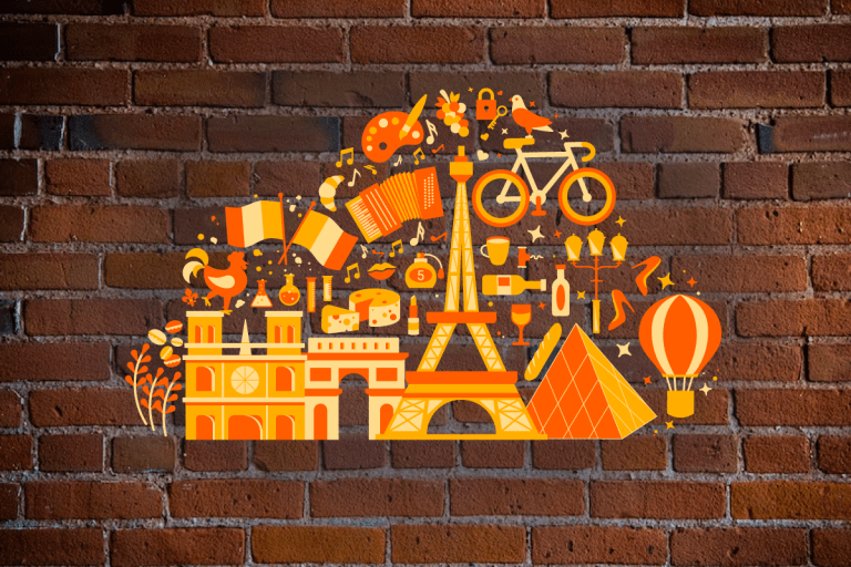 Various icons representing France in the shape of a cloud over a brick wall